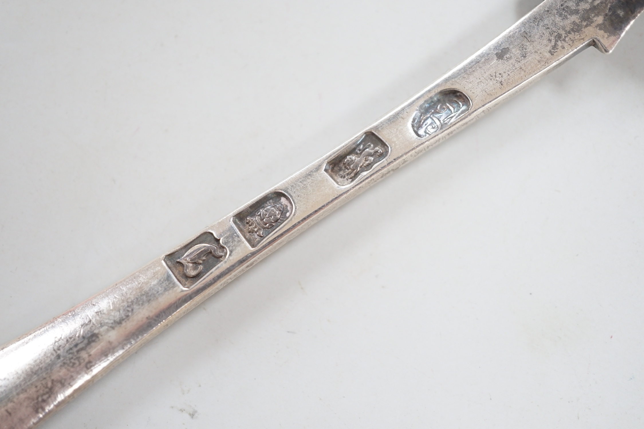 A set of six early George III silver Old English feather edge table spoons, Thompson Davis, London, 1764, 21.3cm, 12.6oz.